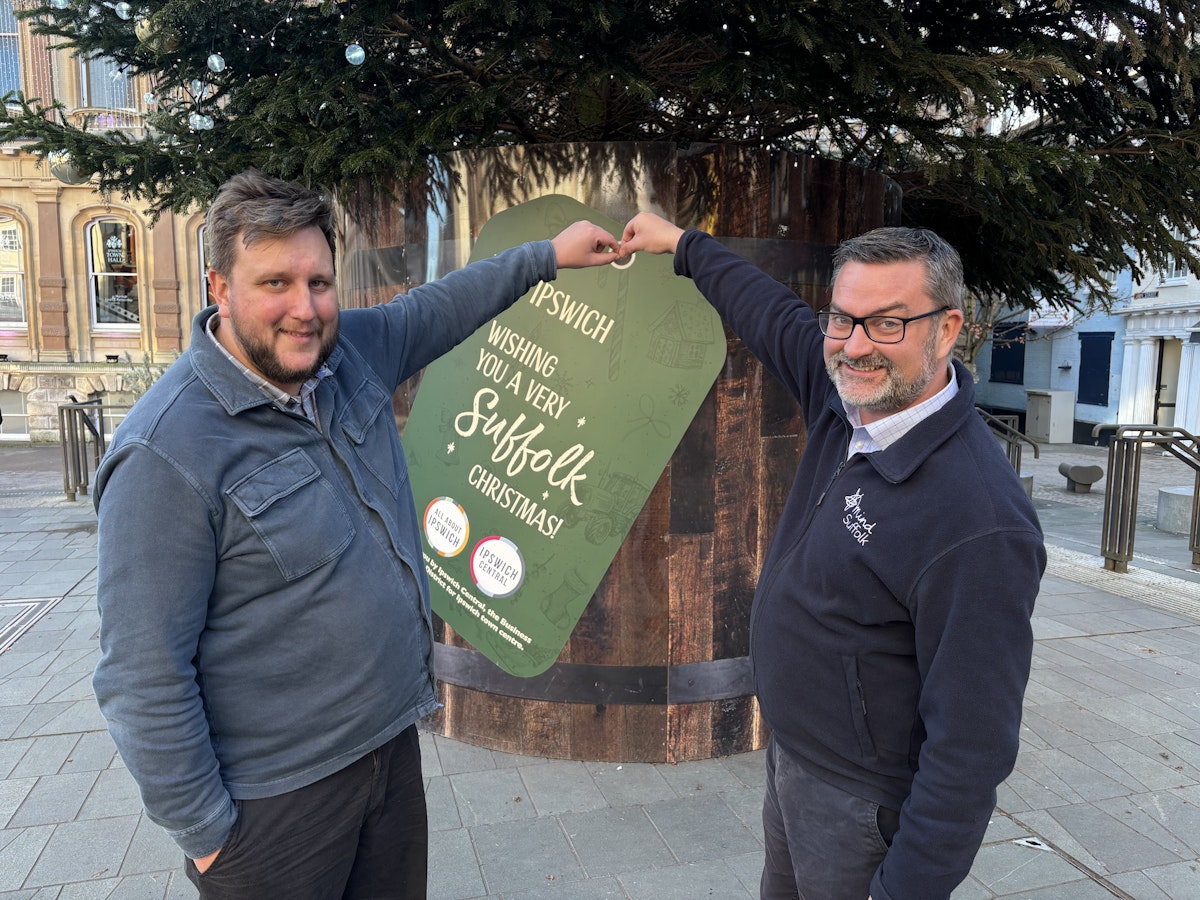 Lee Walker and Jon Neal in front of the Christmas tree on the Cornhill